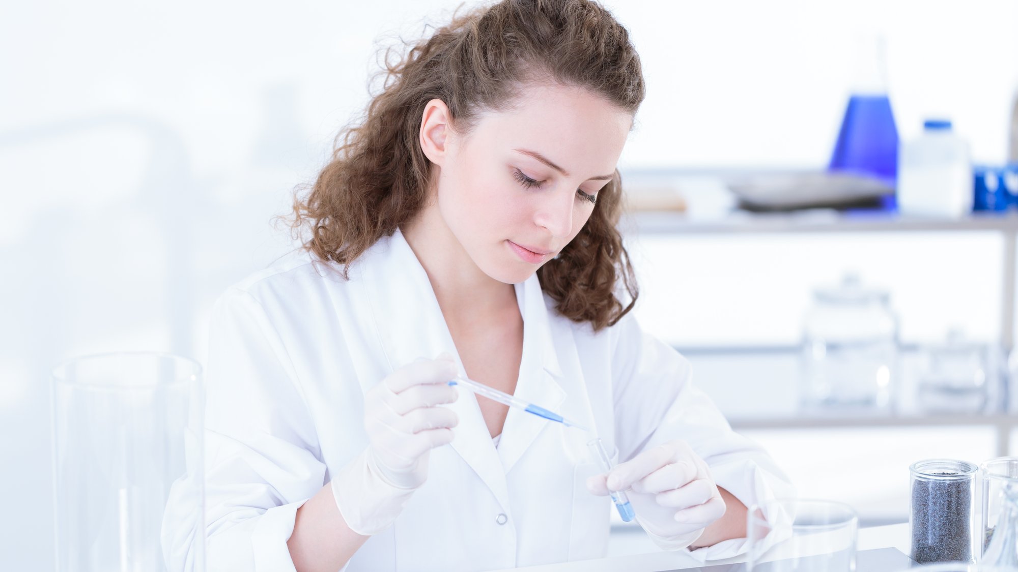 Young scientist analyzing a chemical substance in a lab